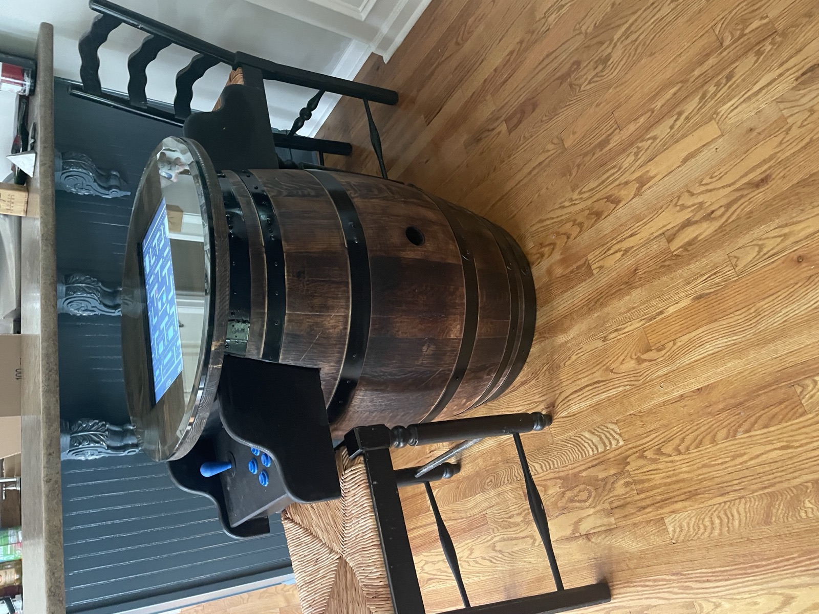 Reclaimed wine-barrel cocktail arcade table with glass-covered game screen